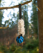 Fårskinnsleksak med handtag